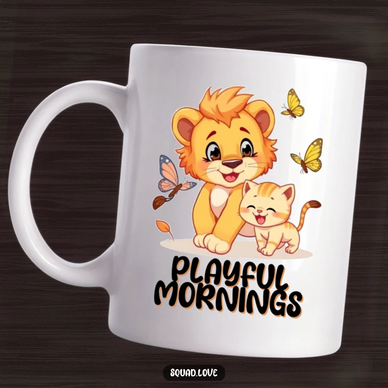 Funny mug showing a cute lion cub playfully chasing a butterfly, with a grinning kitten joining the fun.