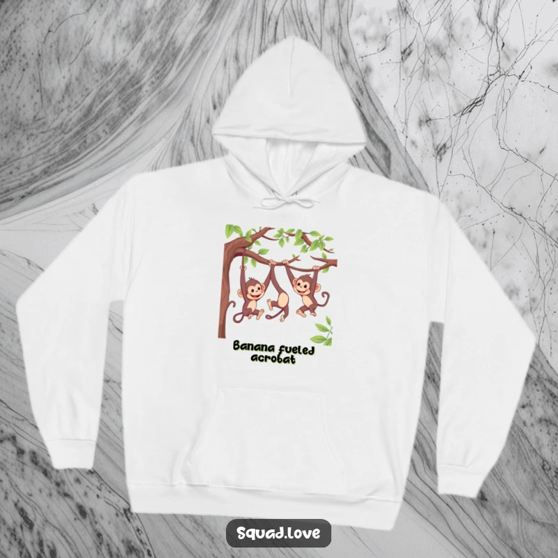 Funny, cozy hoodie featuring lively monkeys swinging from branches, playfully reaching for each other, offering warm, humorous comfort.