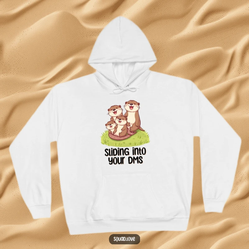 Funny otter family hoodie depicting smiling otters sliding energetically down a lush green grassy hill, perfect for cozy laughs.