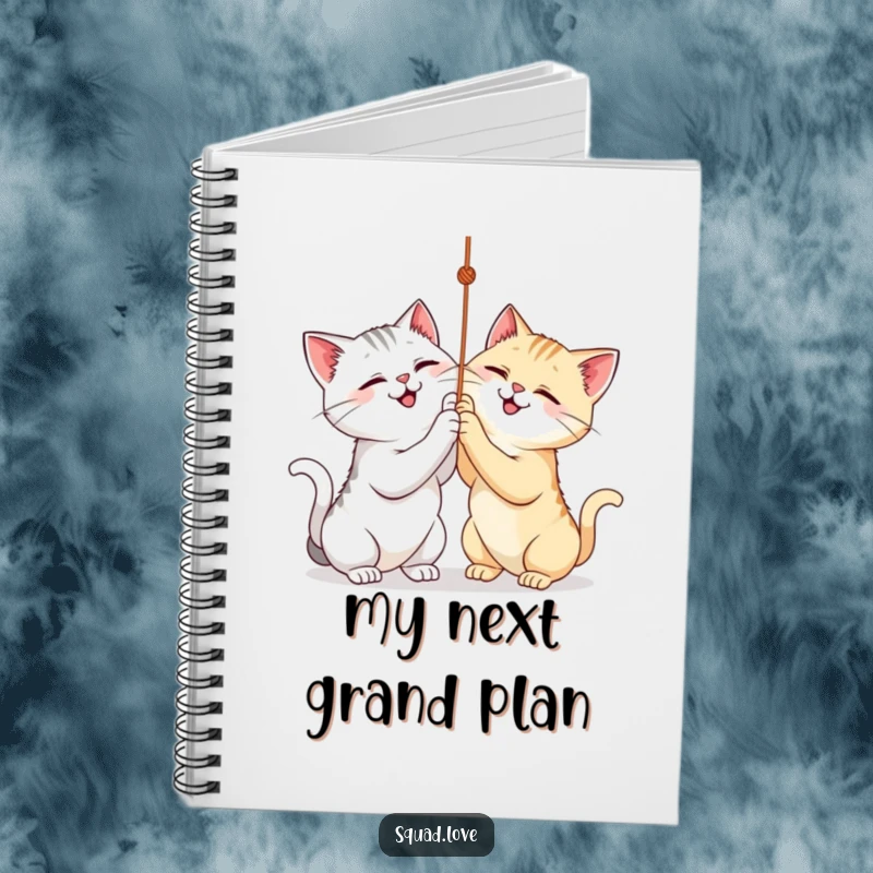 Funny notebook featuring two cats playfully batting at a string, perfect for capturing creative thoughts.