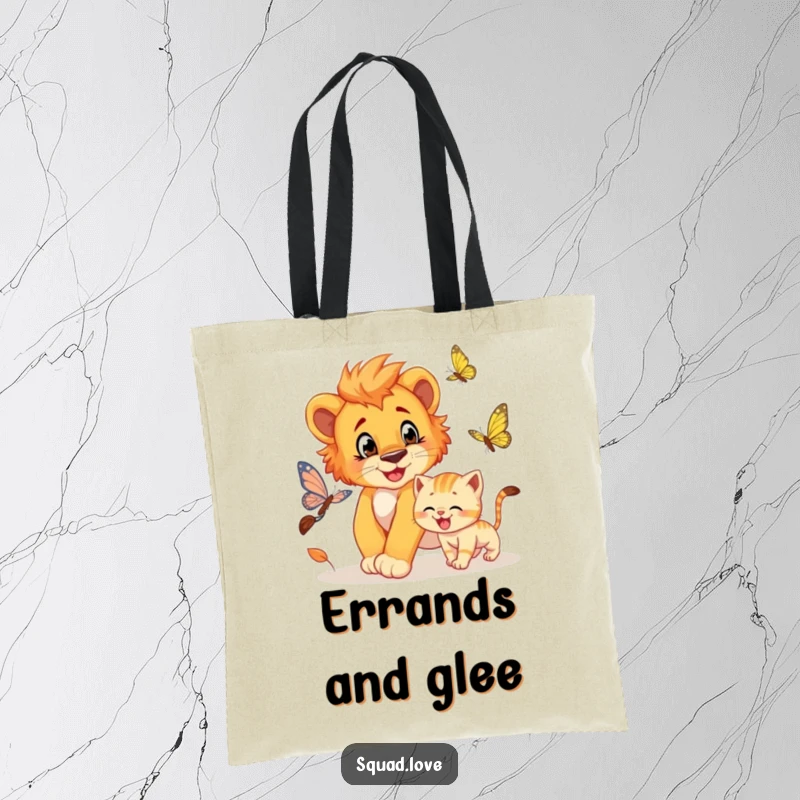 Funny tote bag featuring a lion cub playfully chasing a butterfly, with a grinning kitten in pursuit too.